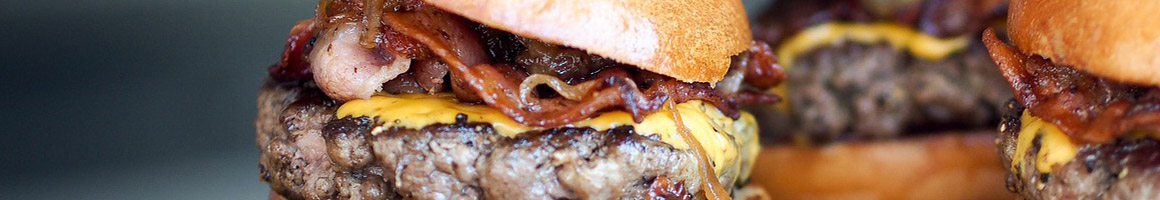 Eating Burger Diner at Log Cabin Restaurant restaurant in Schofield, WI.